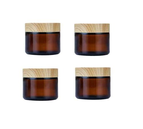 4Pack 50g Amber Glass Cosmetic Jars, Empty Sample Containers with Wood Grain Lids for Lotion, Lip Balm, Eye Cream, Scrubs, Oils, Salves, Ointments (Brown)