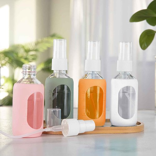 HOMBYS Empty Clear Glass 2oz Small Spray Bottles with Silicone Sleeve Protection - Refillable Containers for Travel, Cleaning Solutions, Essential Oils, Sanitizers - Fine Mist Spray - 4 Pack-Clear