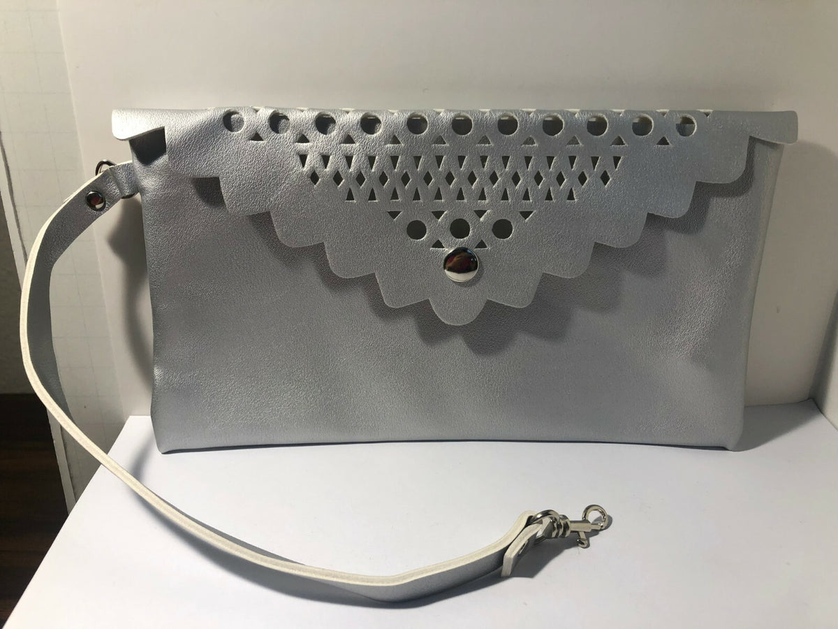 Saks Fifth Avenue Silver Hollow Makeup Bag